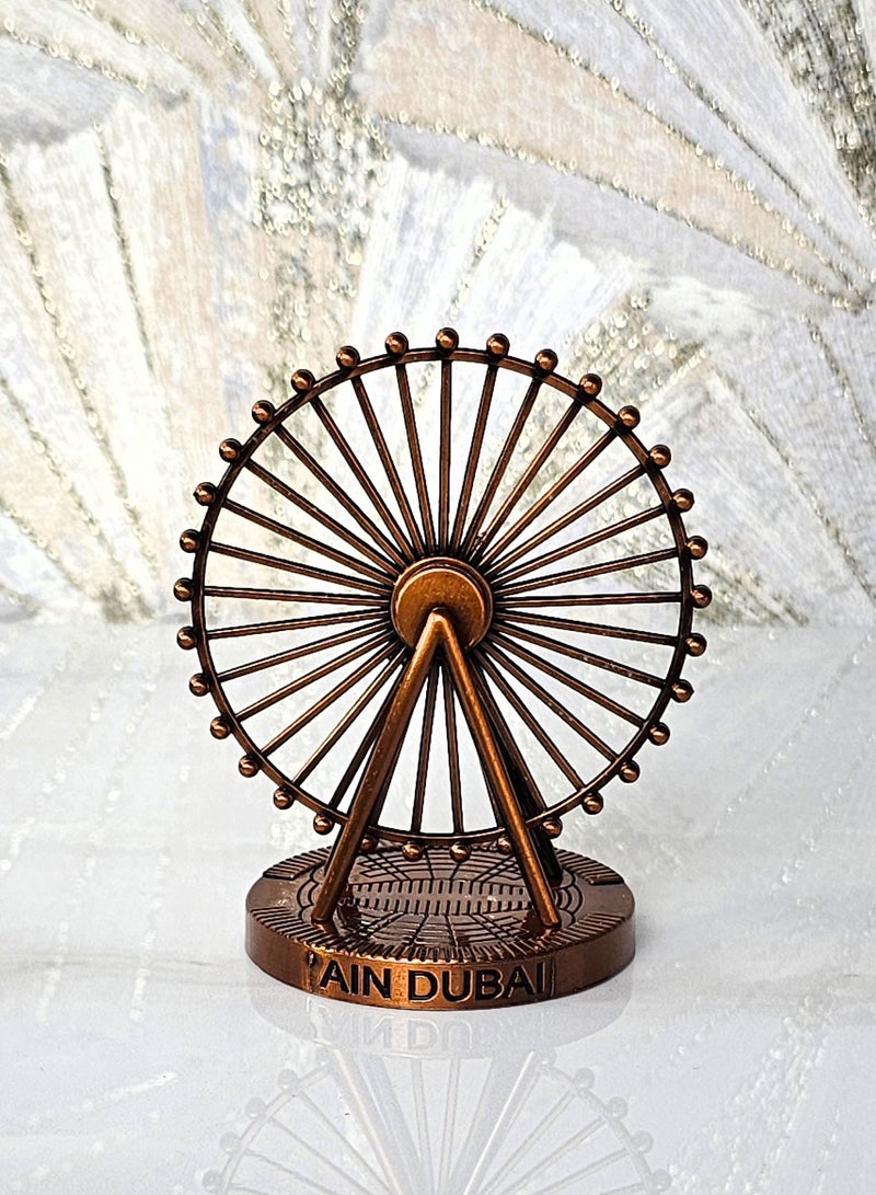 سوق الهدايا التذكارية سوق التذكارات – ديكور عين دبي معدني مقاس 11×10 سم باللون النحاسي - Image 1