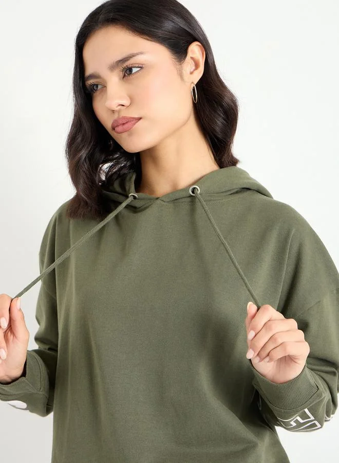 Styli  Oversized Longline Sweatshirt with Dropped Shoulder for Women | Best Price UAE
