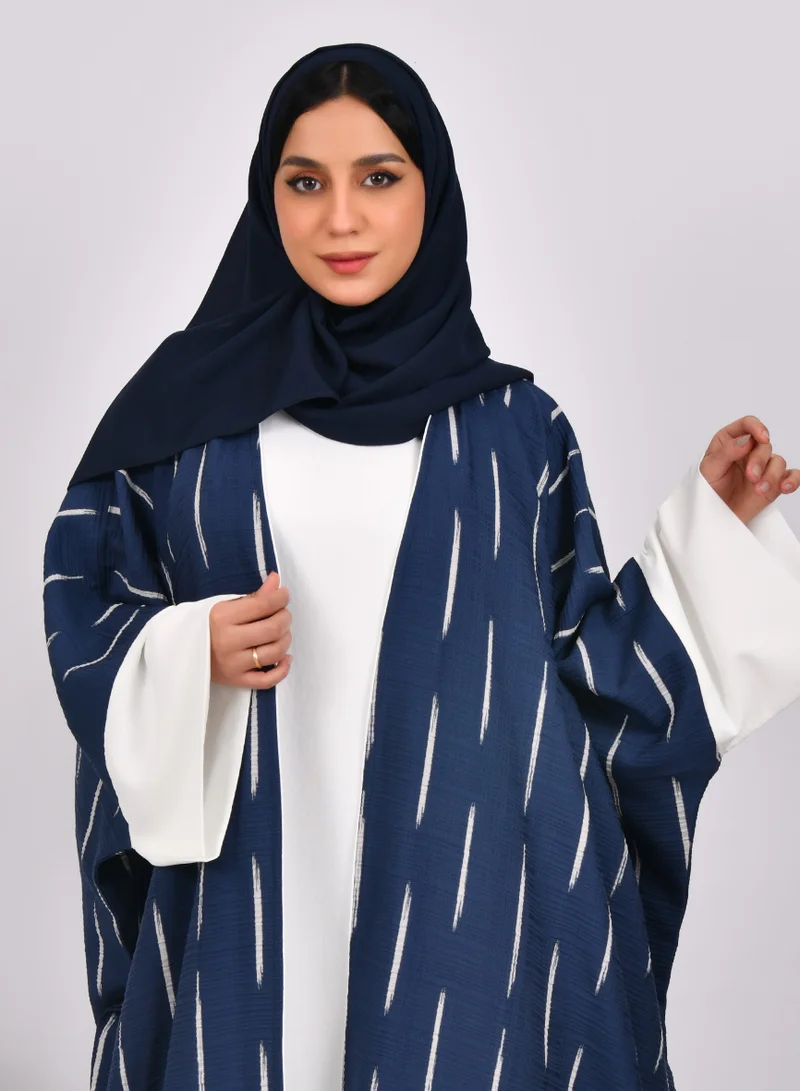 HAWRAA ABAYA Navy blue wide sleeve abaya with white stripes and white dress