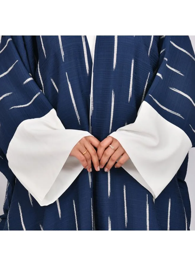 HAWRAA ABAYA Navy blue wide sleeve abaya with white stripes and white dress