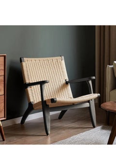 A living room chair made of beech wood and rattan with a streamlined design and a distinctive black color - pzsku/ZC5AB54E80048E476375FZ/45/_/1739620410/c7a8d147-903e-4fc7-84f1-c0942cc3427b