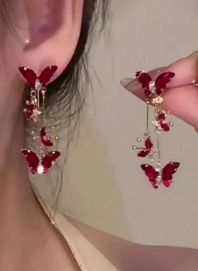 تايك تو أقراط متدلية على شكل فراشة بلون خمري