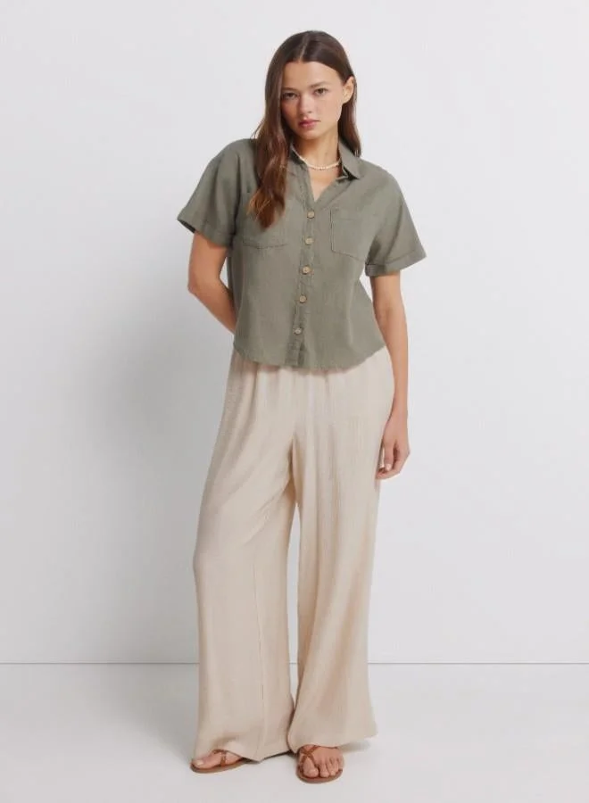 Springfield  Linen shirt. Short folded sleeve. V-neck shirt collar. Front buttons. Patch pockets. for Women | Best Price UAE