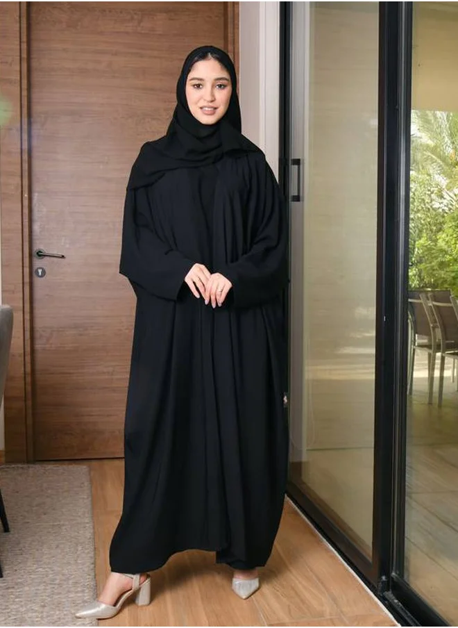 HAWRAA ABAYA A black summer wrap abaya with a simple and practical patterned fabric