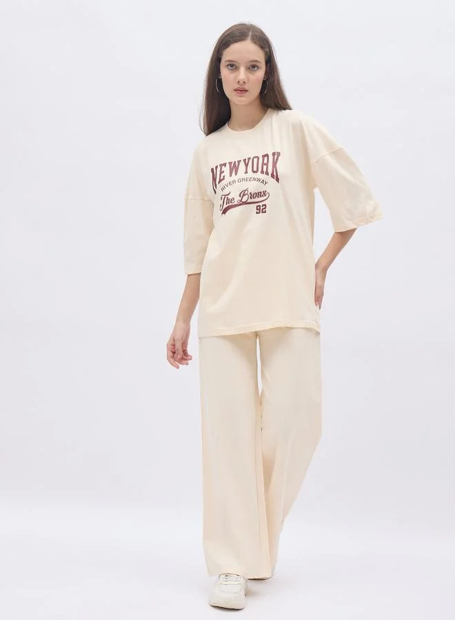 ستايلي Styli Cream NY Print Oversized T-Shirt and Wide Leg Joggers Co-Ords