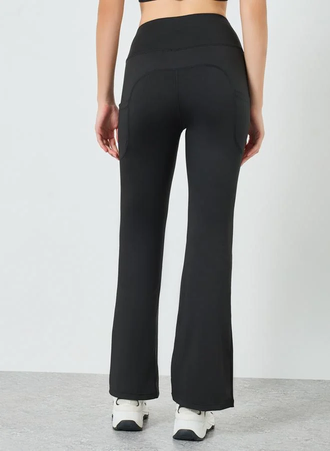 Styli Active  Women Rubber Logo Back Reflective Strip Flare Leggings for Women | Best Price UAE