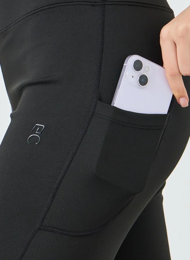 Styli Active  Women Rubber Logo Back Reflective Strip Flare Leggings for Women | Best Price UAE