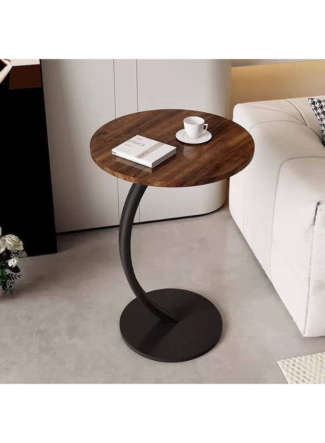 C-shaped side table with a round top and metal legs - Image 3