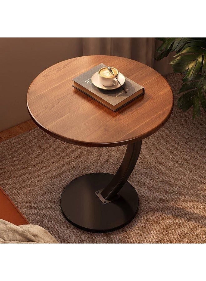 C-shaped side table with a round top and metal legs - Image 1