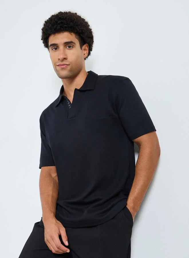 Men Black Solid Relaxed Fit Polo