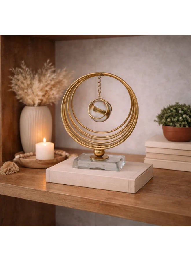 Modern Decorative Sculpture with Graduated Gold Rings & Suspended Crystal Sphere - Image 1