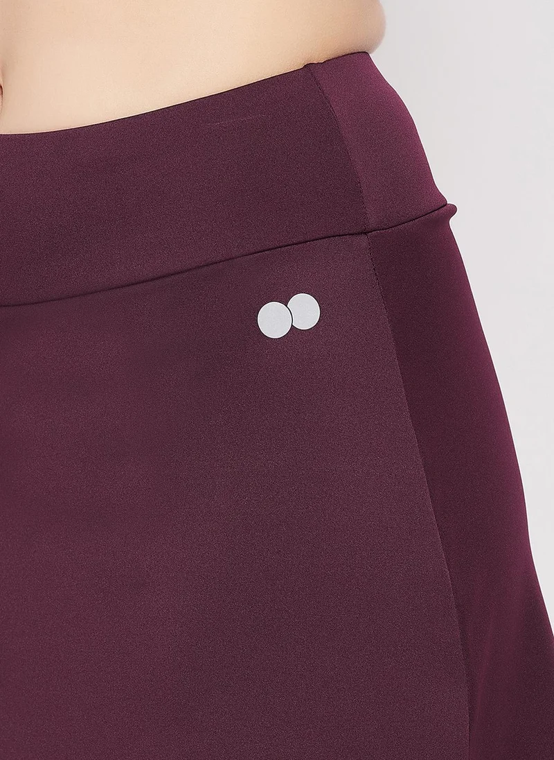 Clovia burgundy Clovia Snug-Fit High Rise Active Skirt with Attached Tights in Plum Colour for Women | Best Price UAE