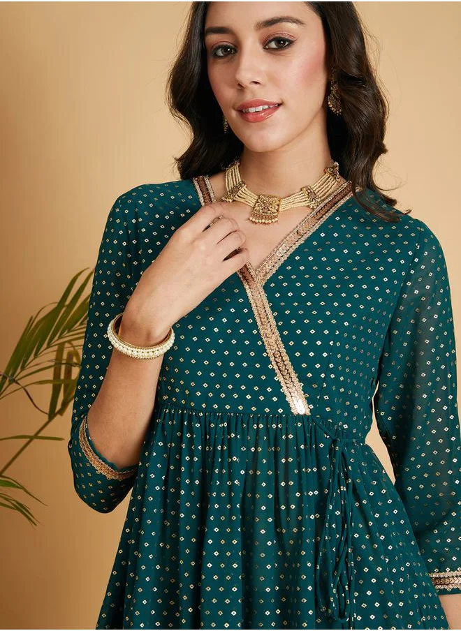 SASSAFRAS Embroidered Trim Foil Print Wrap Peplum Top by Styli
