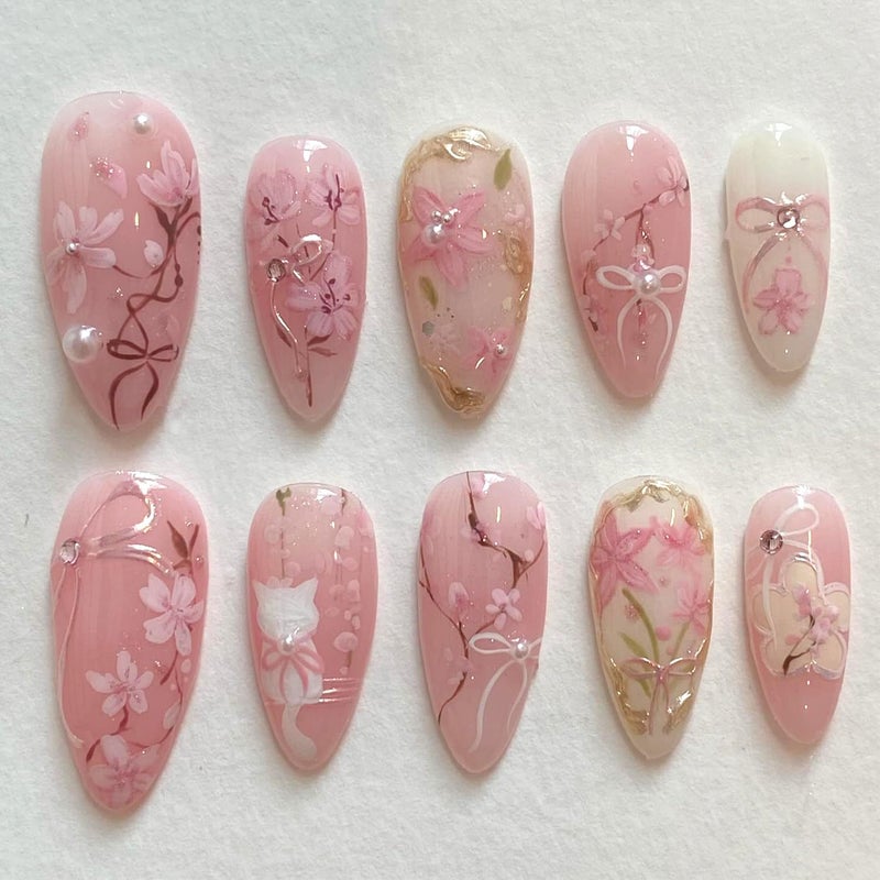 KRTBKR 30Pcs Pink Flower Press on Nails Medium Almond Fake Nails Peach Blossom with 3D Rhinestones Pearl Gold Glitter Design Artificial Cute Cat Nails Stick on Nails Spring False Nails for Women Acrylic Nail - Image 1