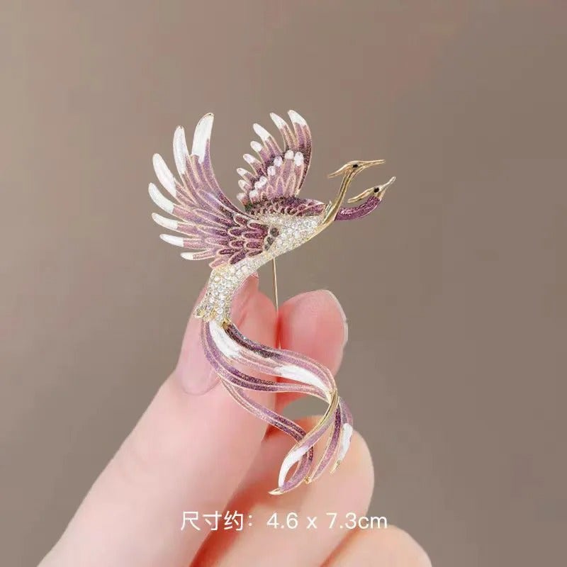 The Black Pearl Accessories Golden Purple Zirconic Phoenix Brooch - Image 1