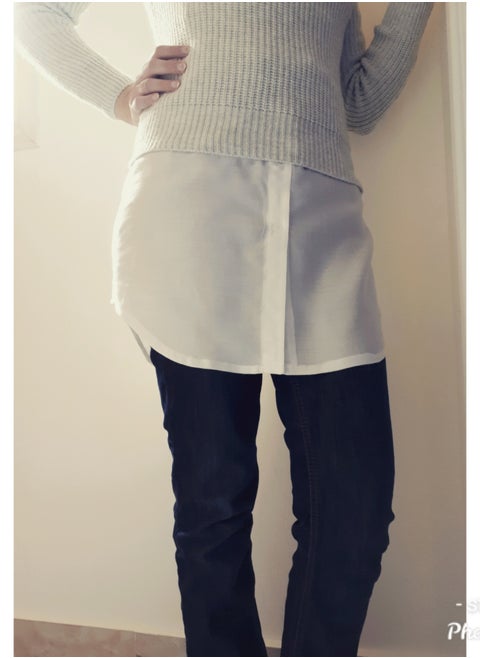 skirt or half-blouse from the waist to below the hip,off white color worn under a short T-shirt to make it long and comfortable