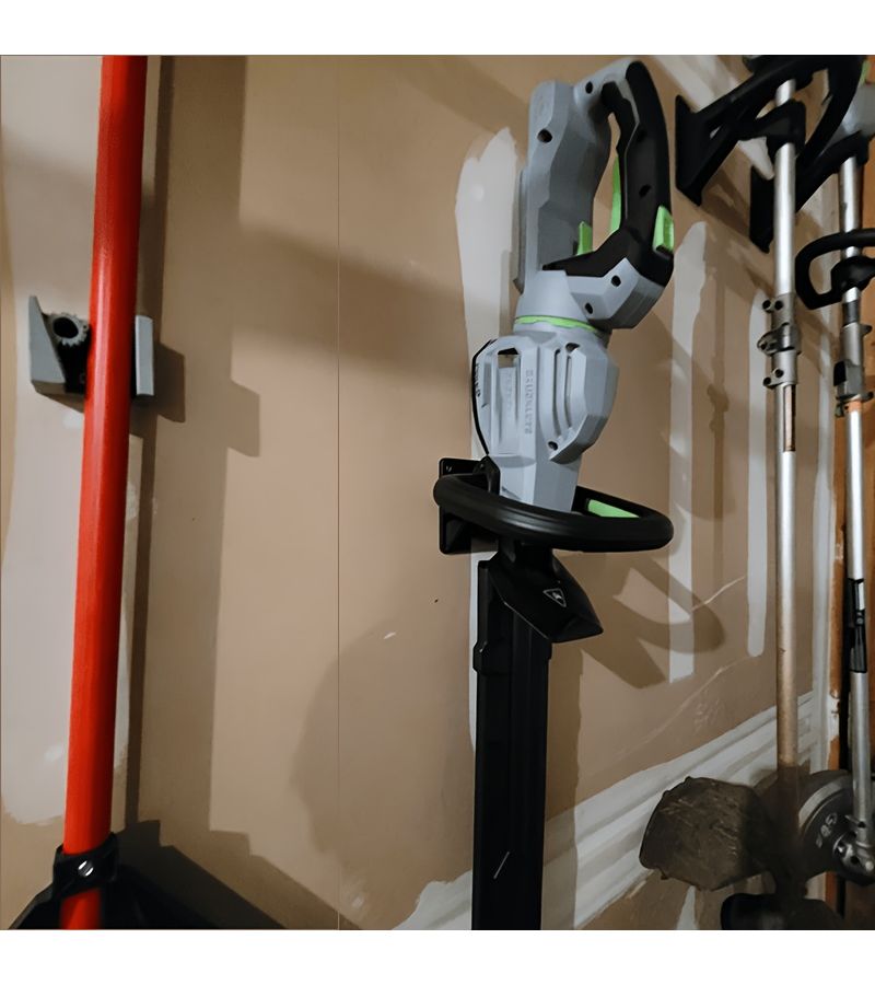 A Black 3D Printed Wall Mounted Bracket For Lawn Mowers And Hedge Trimmers Featuring A Sturdy Design And Durable ABS Material Suitable For Workshops Garages And DIY Enthusiasts - Image 2