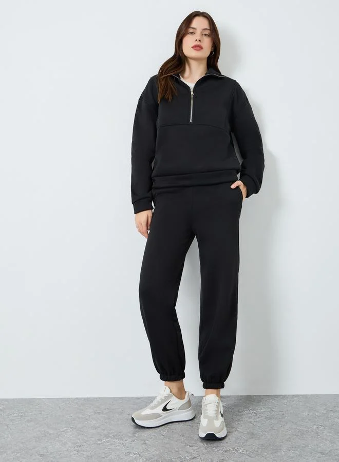 ستايلي طقم بلوزة بسحاب وبنطلون رياضي مضلع