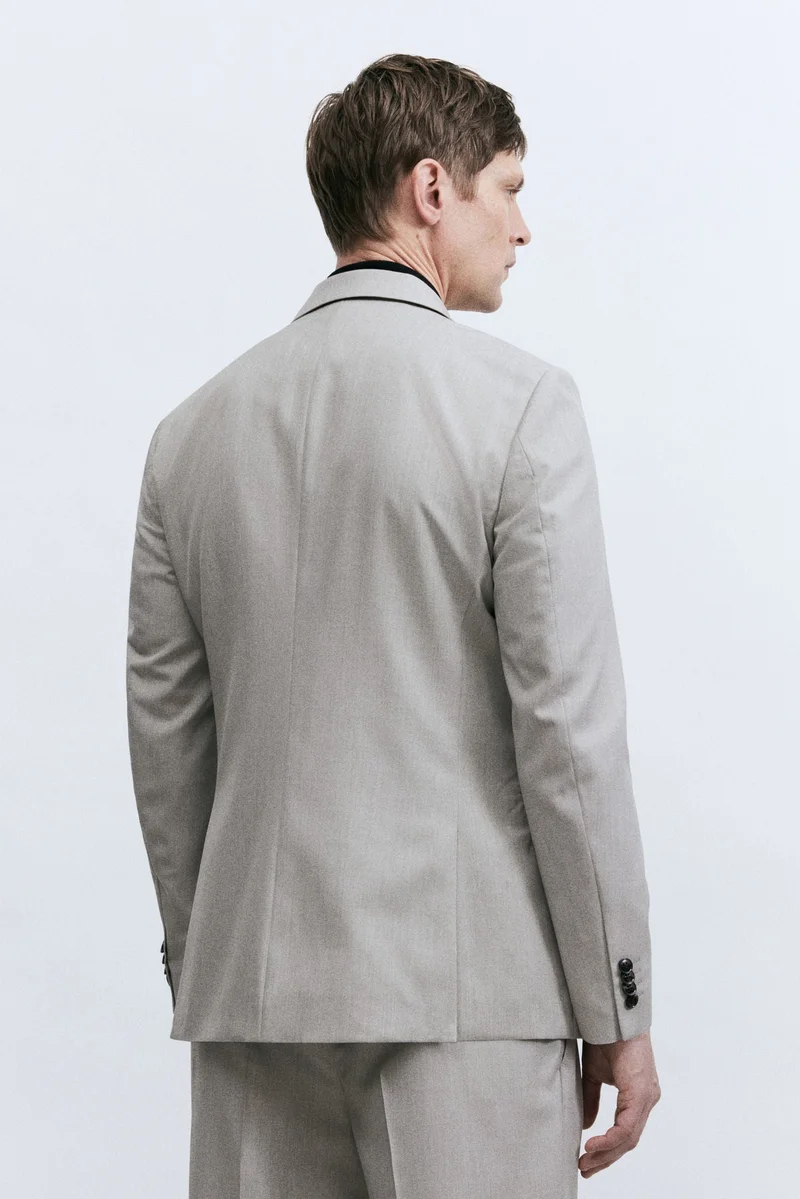 اتش اند ام جاكيت بأزرار مزدوجة وقصّة عادية