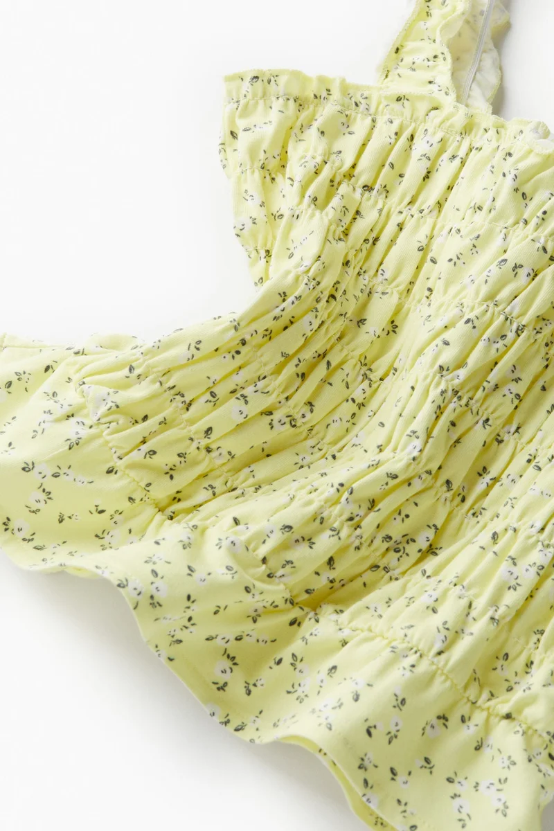 اتش اند ام بلوزة قصيرة بشكشكة