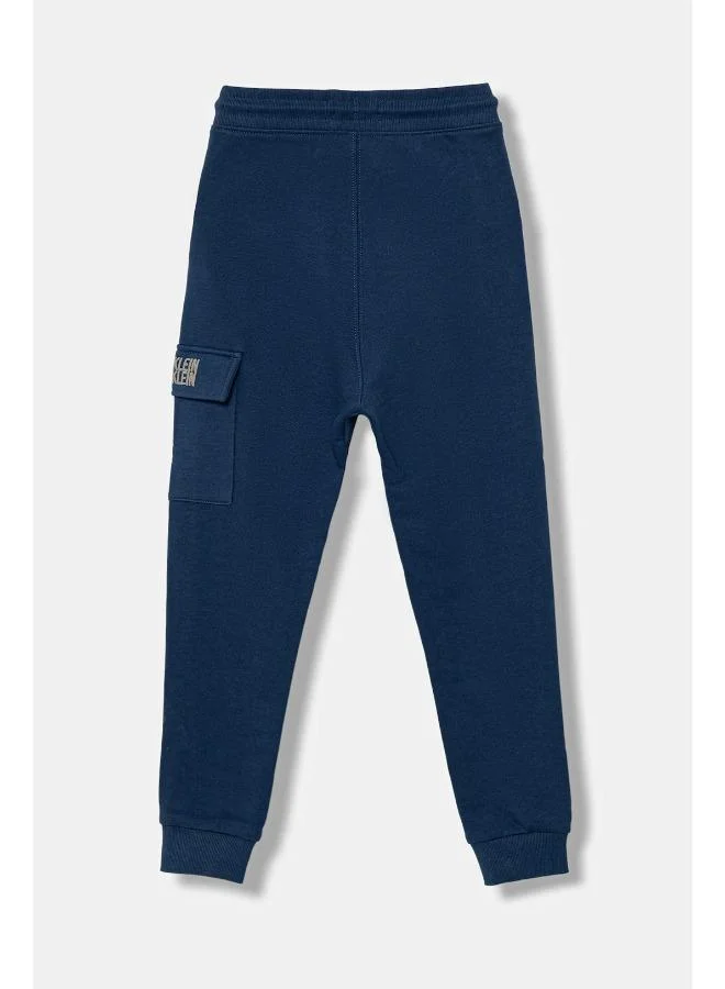 Calvin Klein Jeans C31 Blue Jean Kids Terry Graphic Sweatpants for Men | Best Price UAE