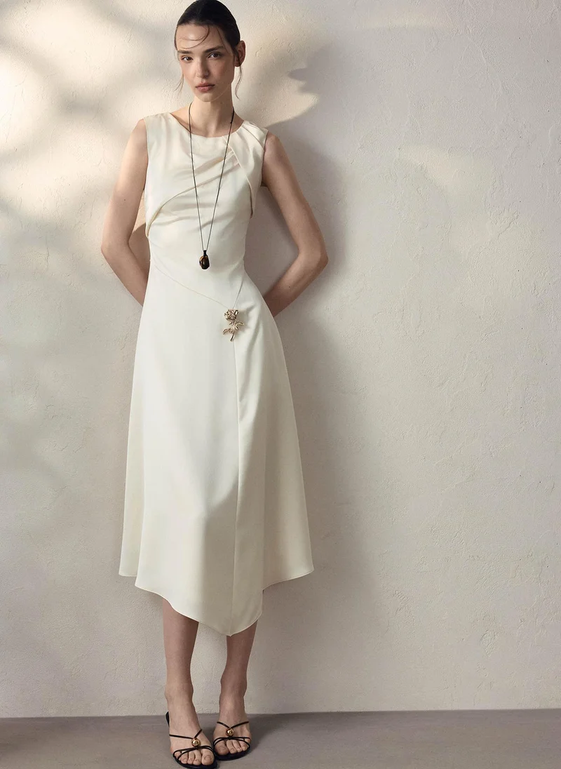 Midi satin dress with draping on the bodice and floral detailing