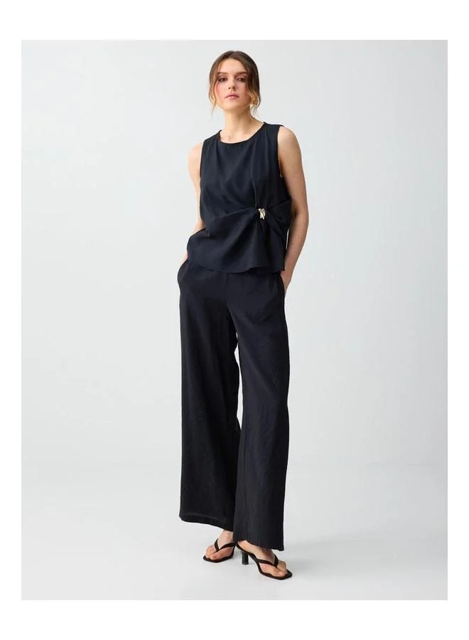 Jimmy Key Black Ruffled Detailed Round Neck Sleeveless Knit Blouse.