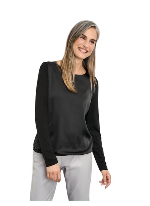 Blouse top with fabric panelling and an elasticated hem