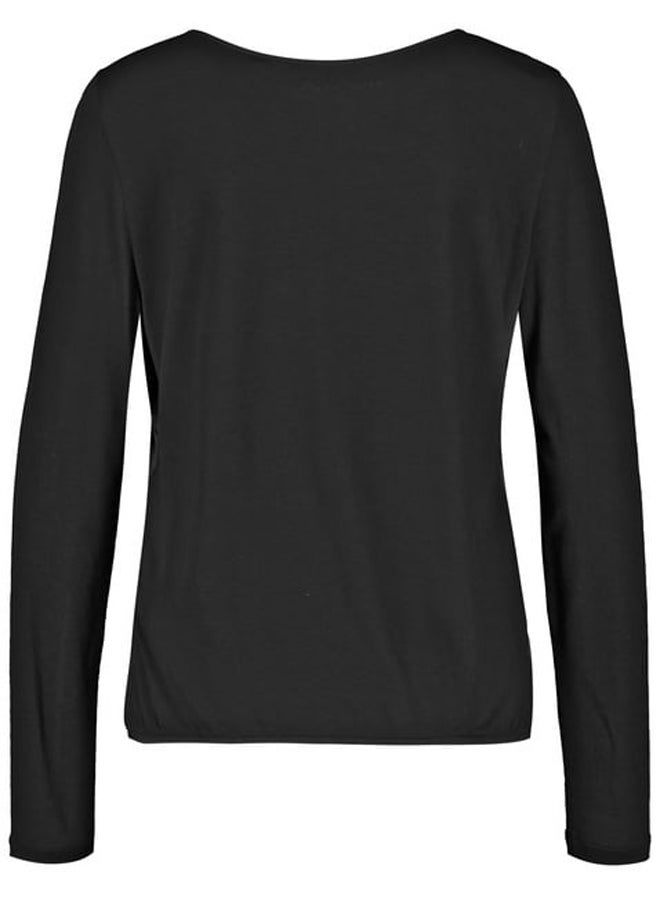 Blouse top with fabric panelling and an elasticated hem