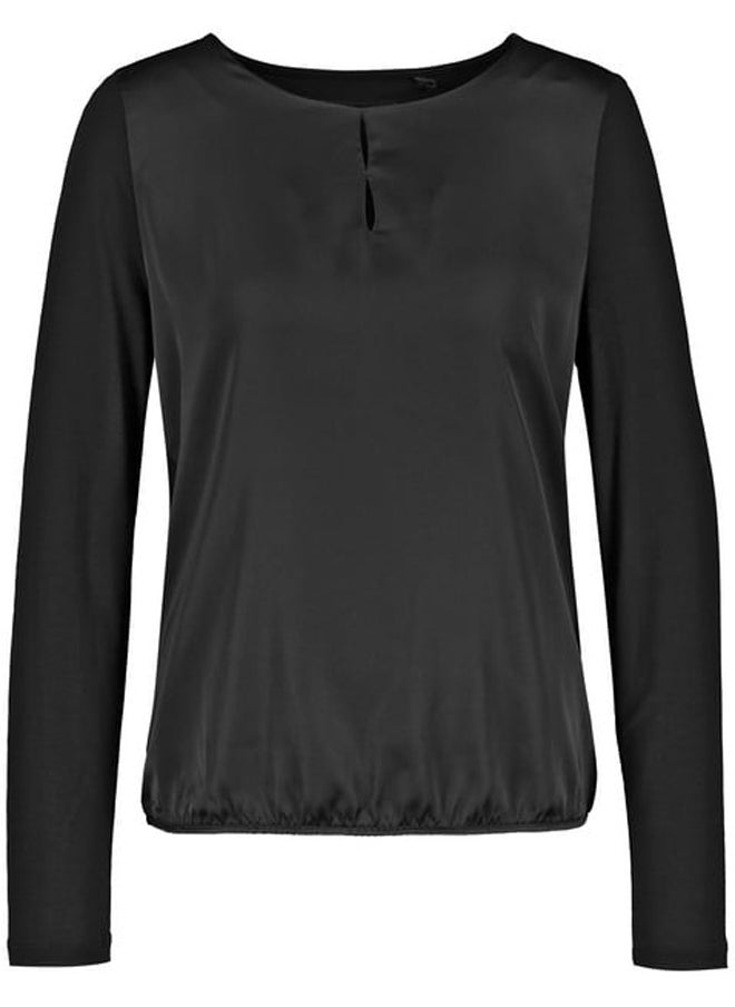 Blouse top with fabric panelling and an elasticated hem