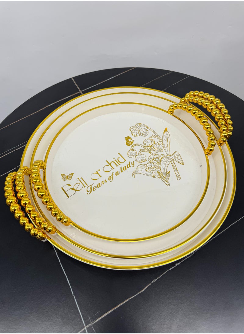Living - A set of three-piece circular serving trays with an elegant wavy design, sugar/gold - Image 1
