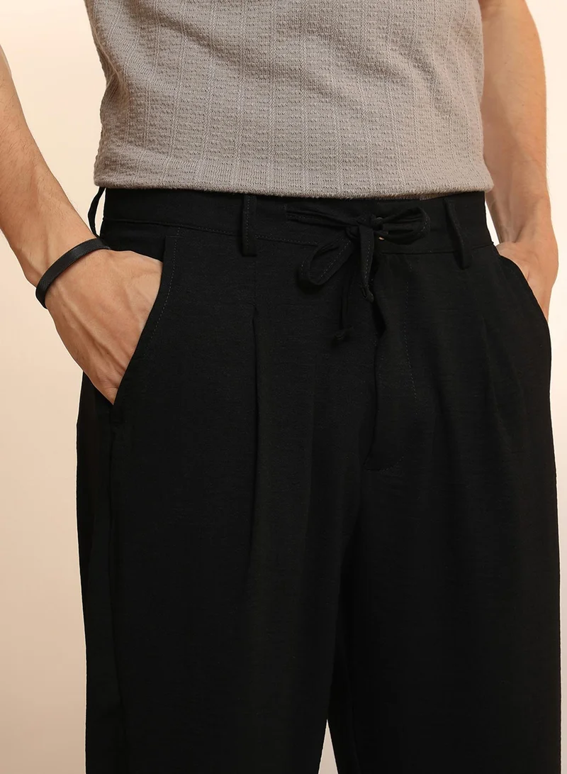 Campus Sutra  Men's Obsidian Black Solid Pleated Trousers for Men | Best Price UAE