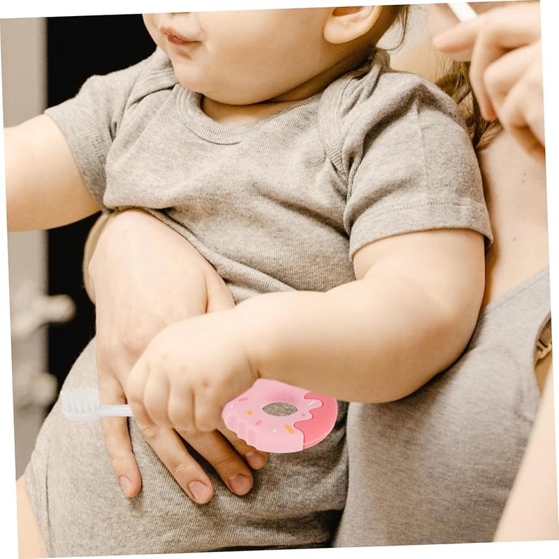 فرشاة أسنان سيليكون وردية على شكل دونات للأطفال بشعيرات ناعمة تشجع على عادة العناية بالفم - Image 4