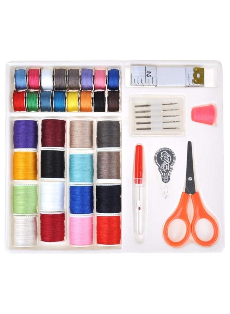 Sewing tools set, consisting of colorful sewing bobbins, scissors, sewing needles, and a multi-colored measuring tape  - Image 1
