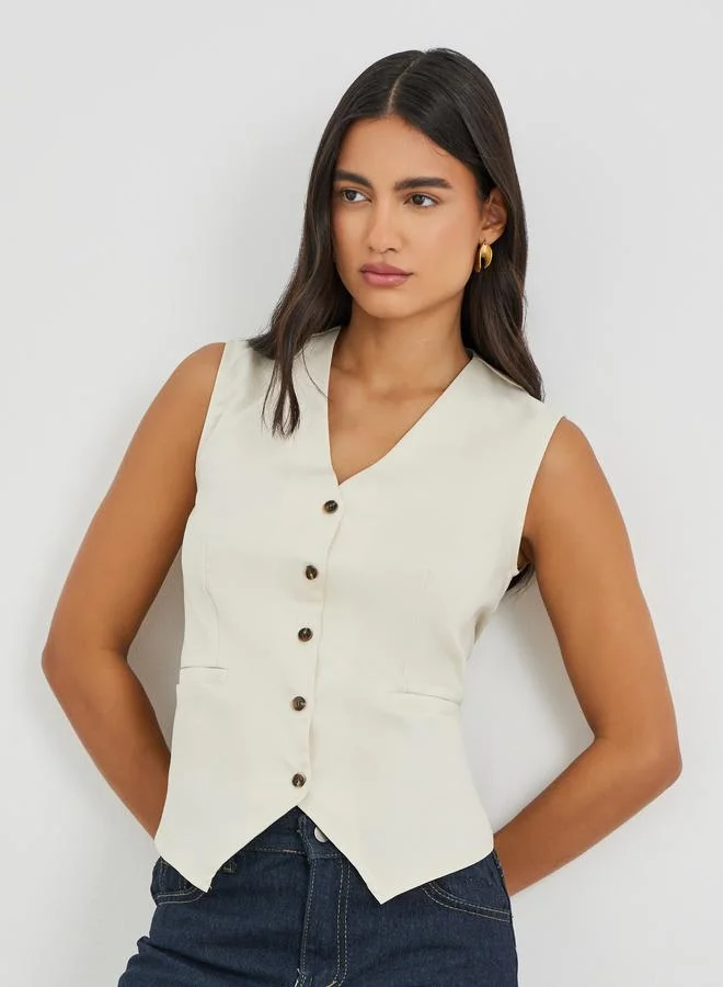 Styli Beige Styli Solid Sleeveless Buttoned Waistcoat for Women | Best Price UAE