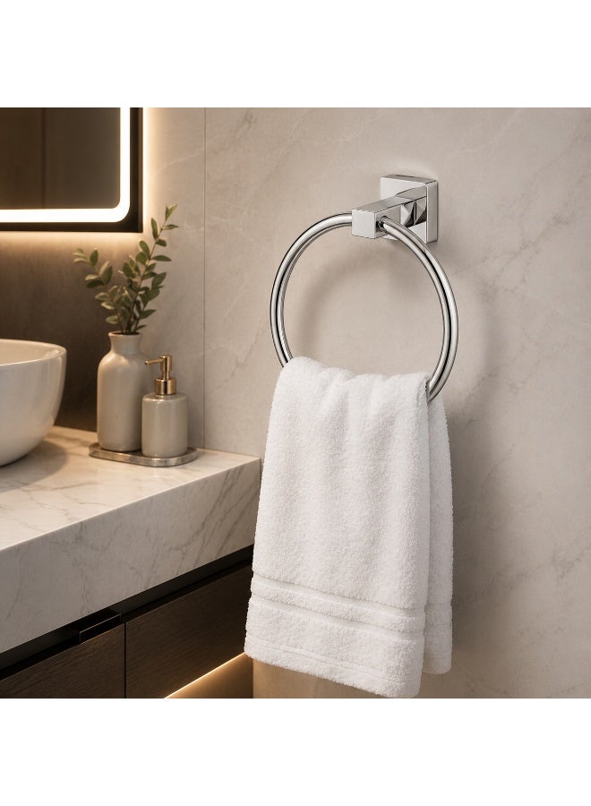 A round, wall-mounted towel rack made of stainless steel. - Image 1