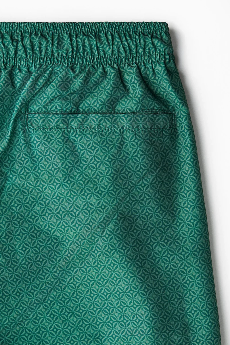 اتش اند ام شورت سباحة مزين بنقوش