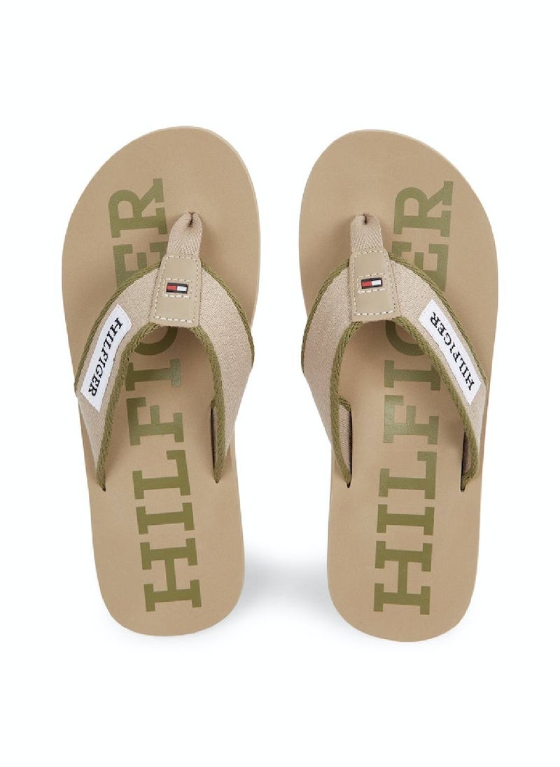 TOMMY HILFIGER - Men's Hilfiger Monotype Webbing Strap Flip-Flops -  Polyester webbing upper, Beige - Image 1