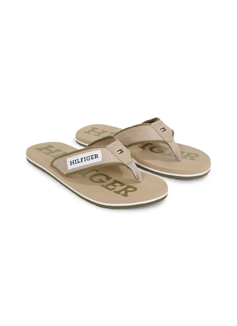 TOMMY HILFIGER Men's Hilfiger Monotype Webbing Strap Flip-Flops -  Polyester webbing upper, Beige