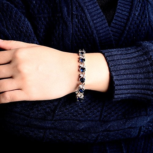 RIZILIA BLOSSOM Round Simulated Blue Sapphire and White Cubic Zirconia 18K White Gold Plated Tennis Bracelet, 7" - Image 5
