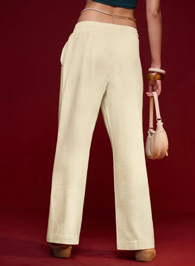 The Souled Store  Cream Solid Flared Joggers for Women | Best Price UAE