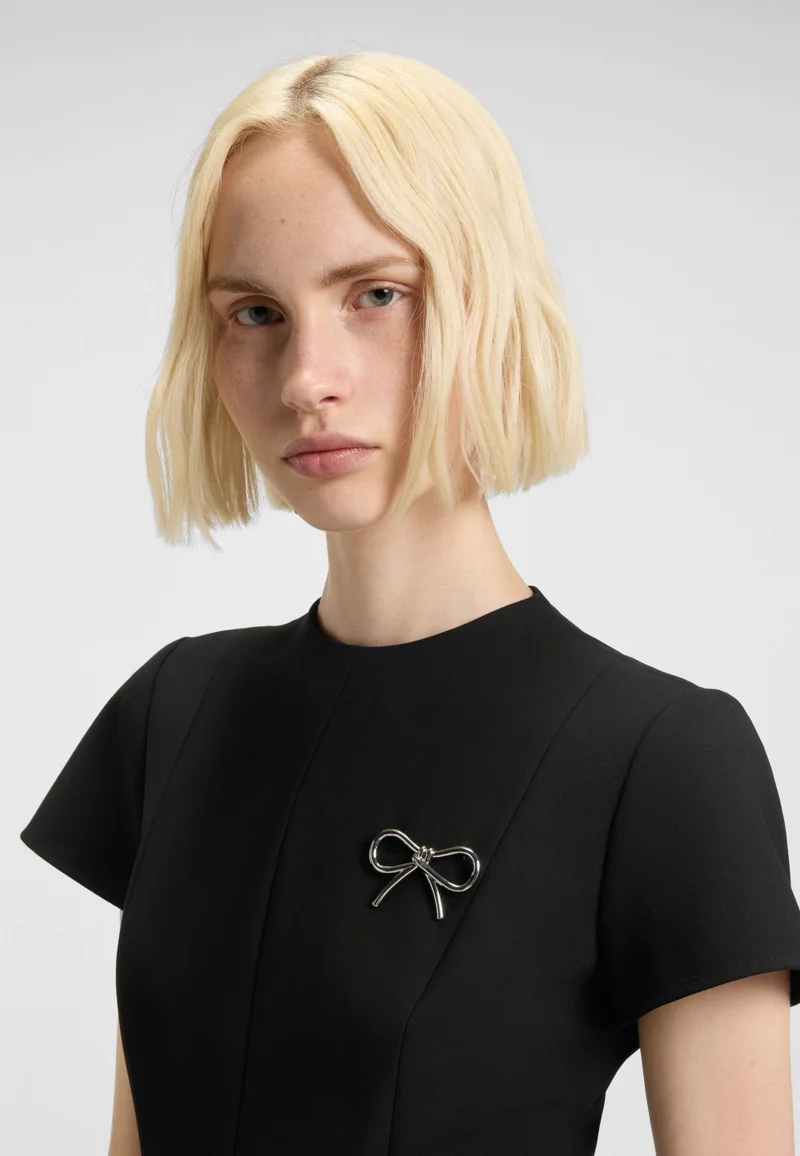HUGO A-line dress with godet inserts and bow brooch