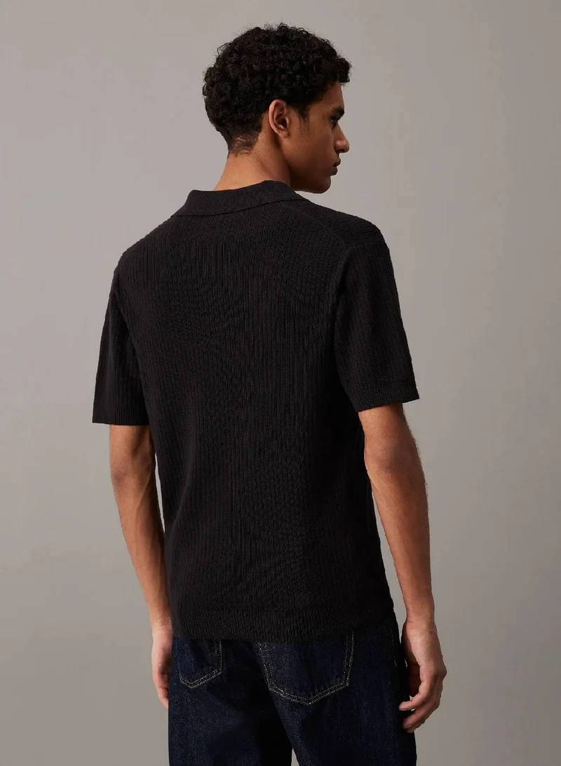 كالفن كلاين جينز سترة بولو مضلعة بأكمام قصيرة