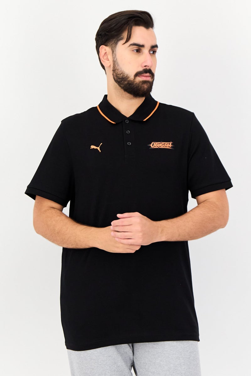 PUMA قميص بولو خارجي بأكمام قصيرة للرجال من بومة × أورانغوتان، أسود - Image 1