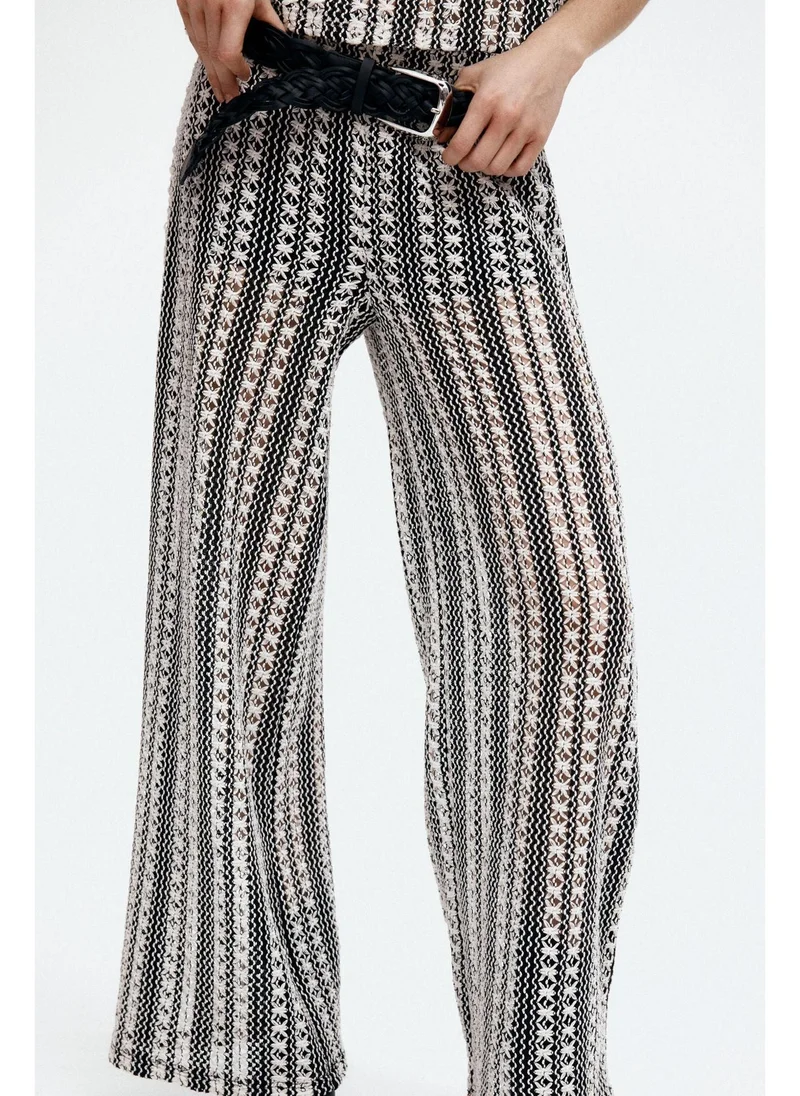 H&M Hole-patterned trousers