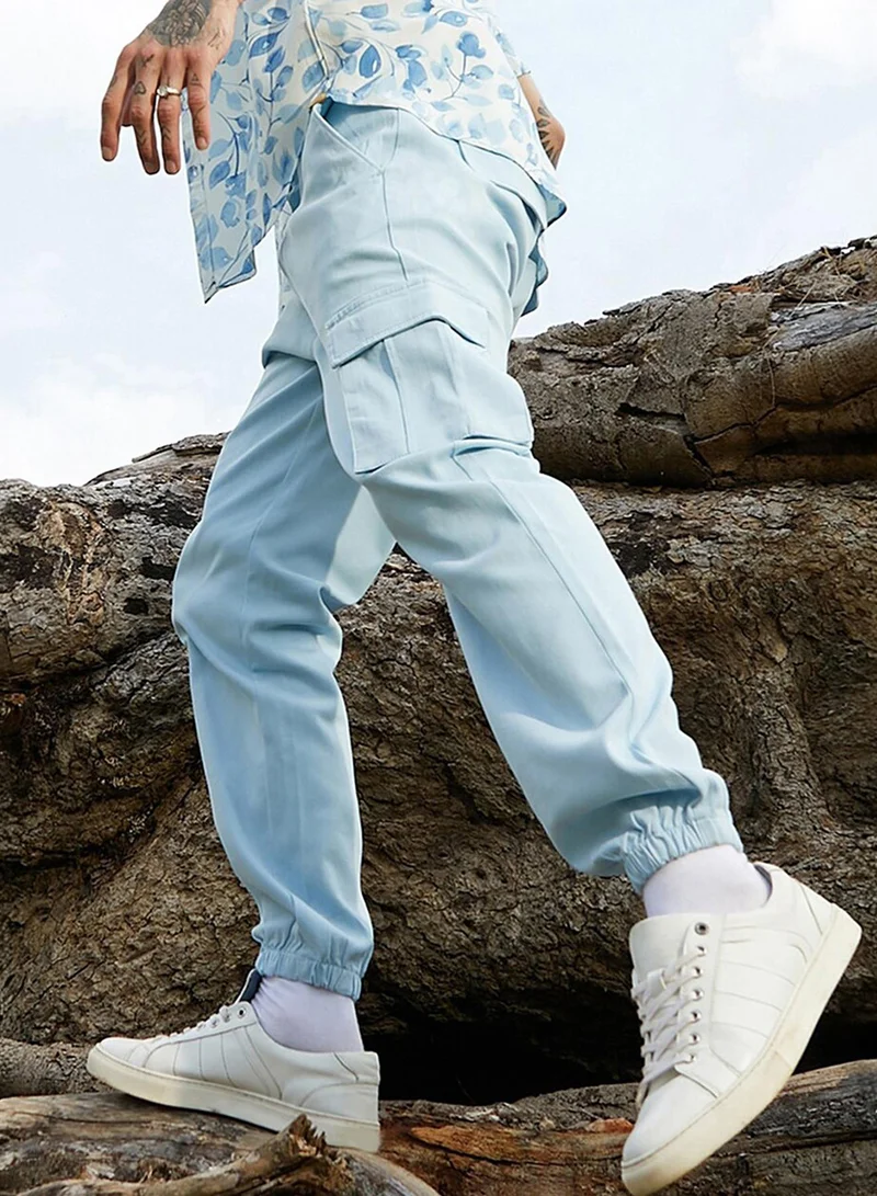 Campus Sutra Men's Light Blue Cuffed Hem Cargo Trousers For Casual Wear | 6 Pockets | Regular Fit | Button Closure | Cotton Poly Cargo Pant Crafted With Comfort Fit For Everyday Wear