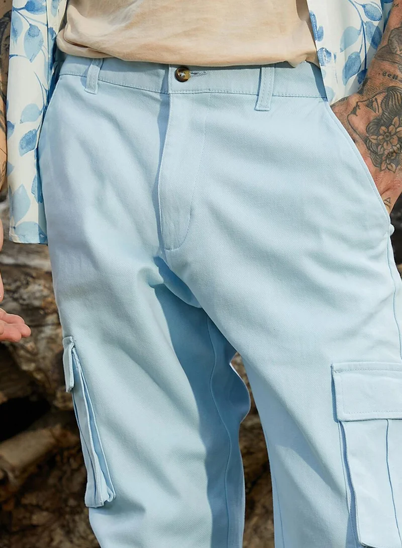 Campus Sutra Men's Light Blue Cuffed Hem Cargo Trousers For Casual Wear | 6 Pockets | Regular Fit | Button Closure | Cotton Poly Cargo Pant Crafted With Comfort Fit For Everyday Wear