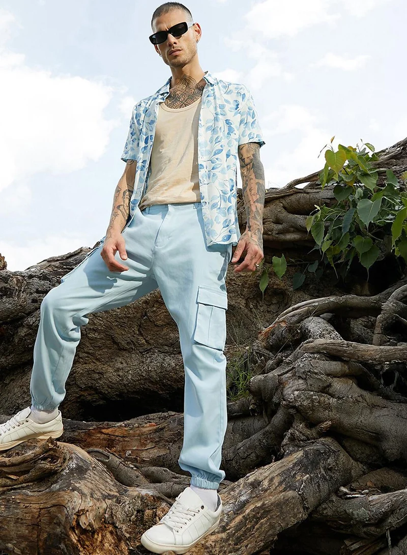 Campus Sutra Men's Light Blue Cuffed Hem Cargo Trousers For Casual Wear | 6 Pockets | Regular Fit | Button Closure | Cotton Poly Cargo Pant Crafted With Comfort Fit For Everyday Wear