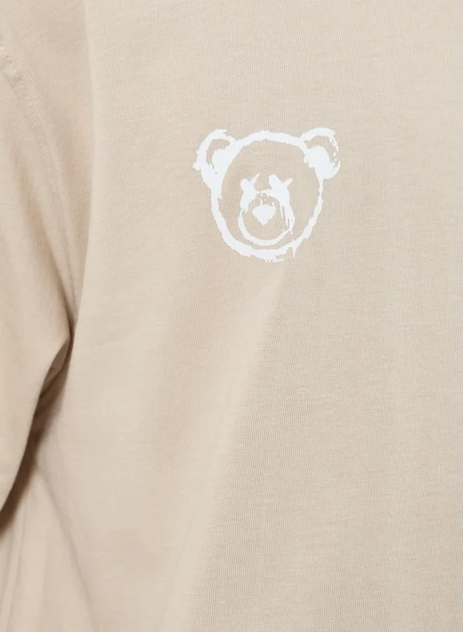 Styli Men Beige Graphic Print Oversized T-Shirt
