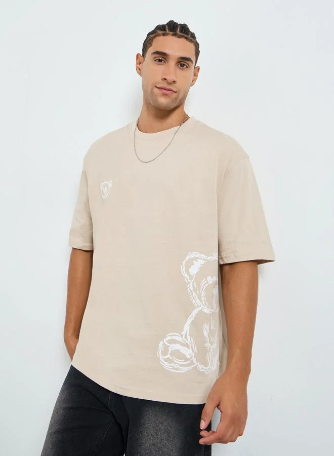 Styli Men Beige Graphic Print Oversized T-Shirt